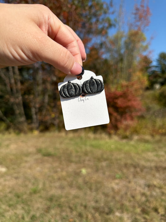 Black pumpkin studs